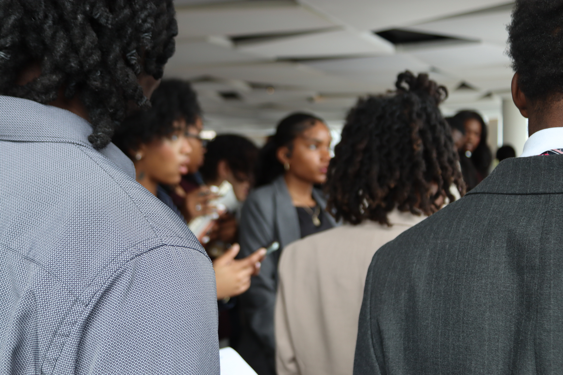 Cornerstone team members gathered in conversation at a company conference